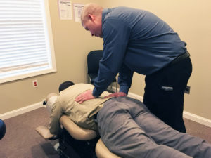 Dr. Miller performing an adjustment - A chiropractor is a health-care professional who focuses on the body’s ability to heal itself. Can chiropractic care help you maintain your wellbeing?